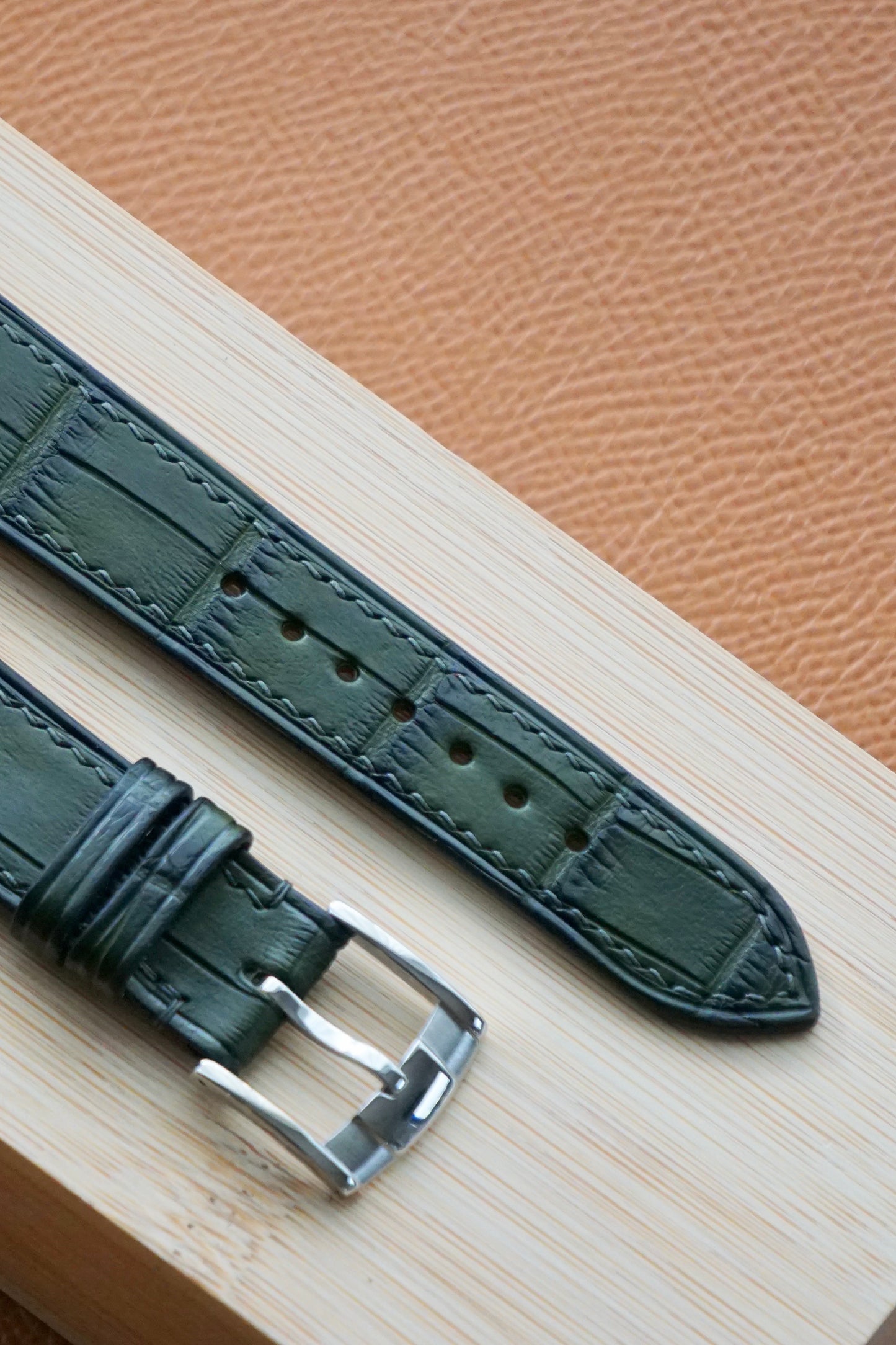 Crocodile leather in patinaed deep green watch strap.
