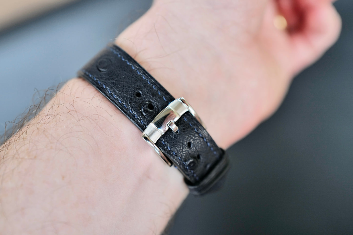 Navy blue Ostrich Leather strap.